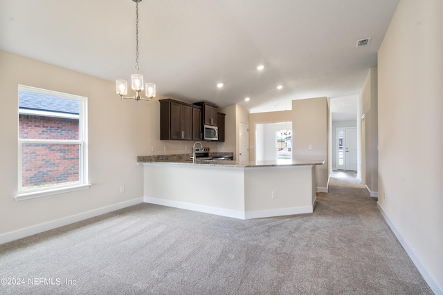 kitchen with light carpet, dark brown cabinetry, baseboards, visible vents, and appliances with stainless steel finishes