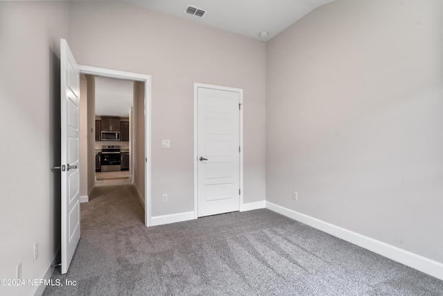 unfurnished bedroom with baseboards, visible vents, and carpet flooring