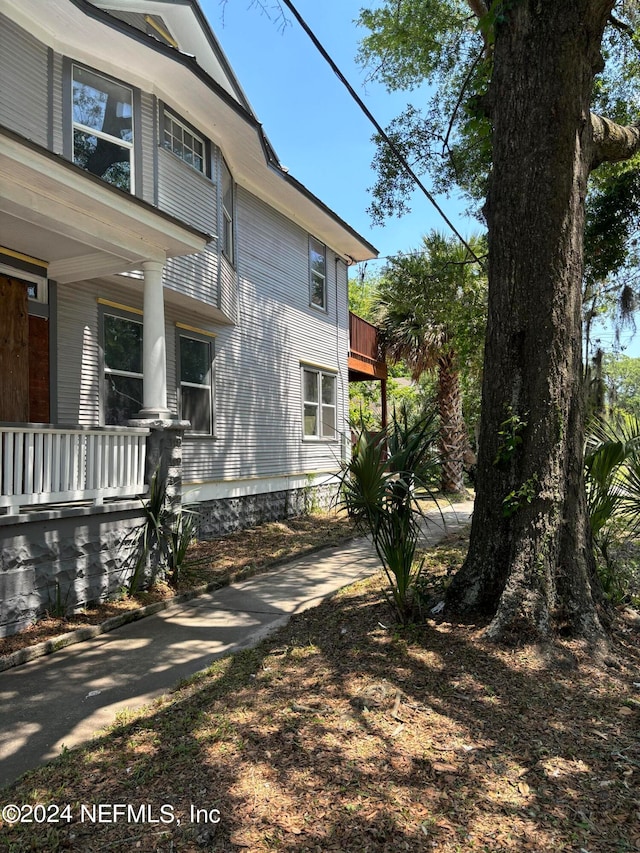 view of home's exterior with a balcony