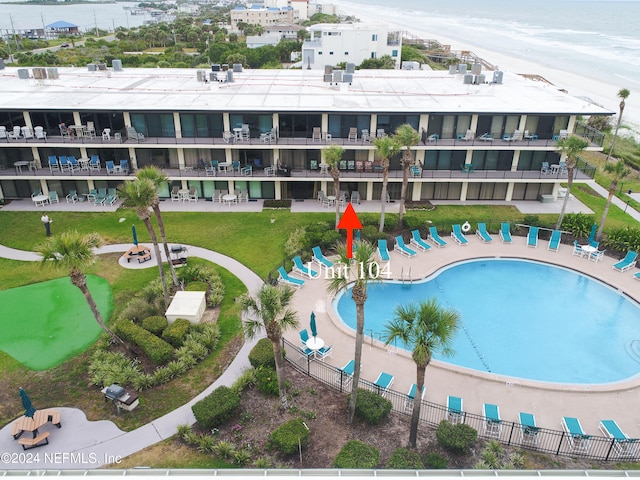 view of swimming pool featuring a water view