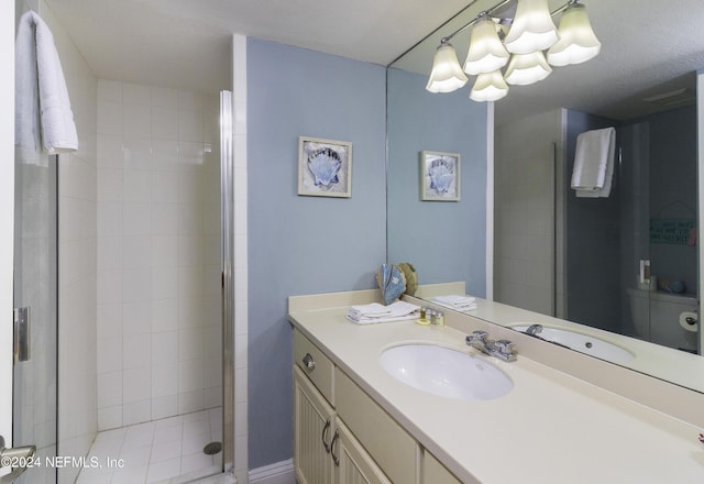 bathroom featuring a stall shower and vanity