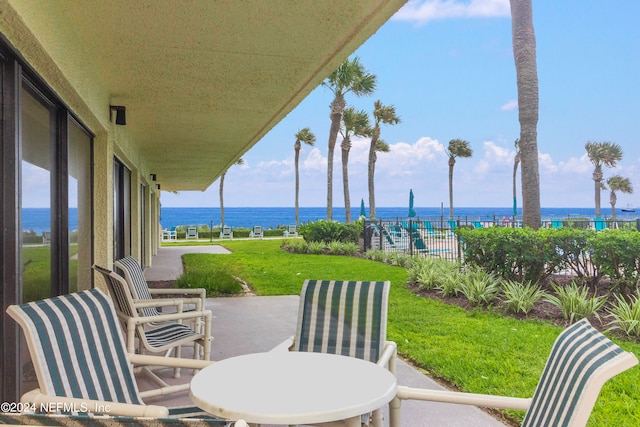 view of patio with a water view