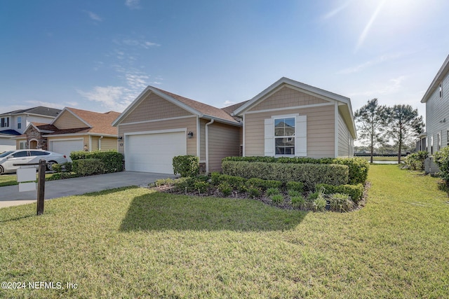 single story home with a garage and a front lawn