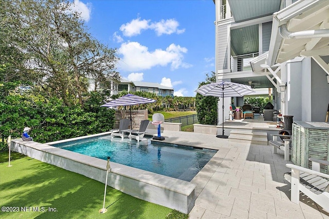 view of pool featuring a patio