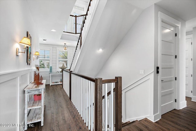 corridor featuring dark hardwood / wood-style floors