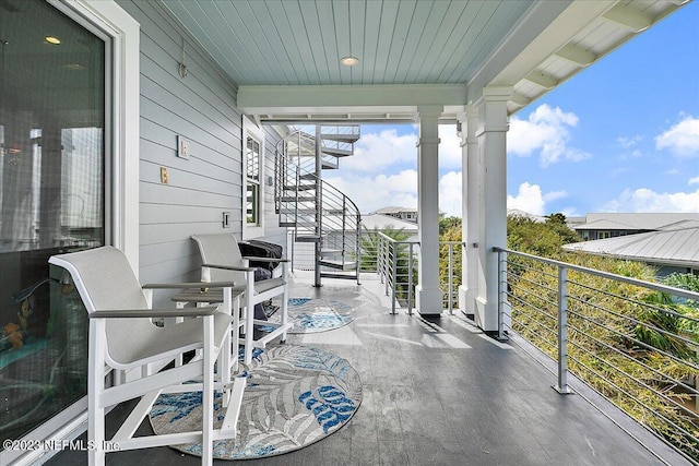 view of patio / terrace with a balcony