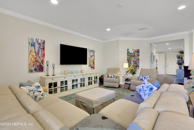 living room featuring ornamental molding and wood-type flooring