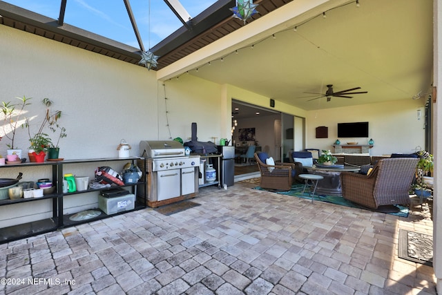 view of patio / terrace with glass enclosure and ceiling fan