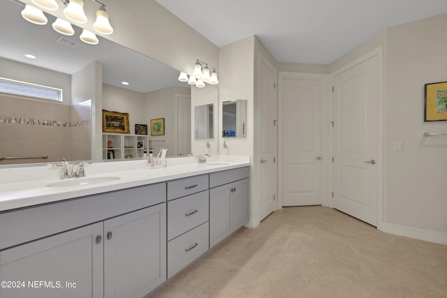 bathroom with tile floors and dual bowl vanity