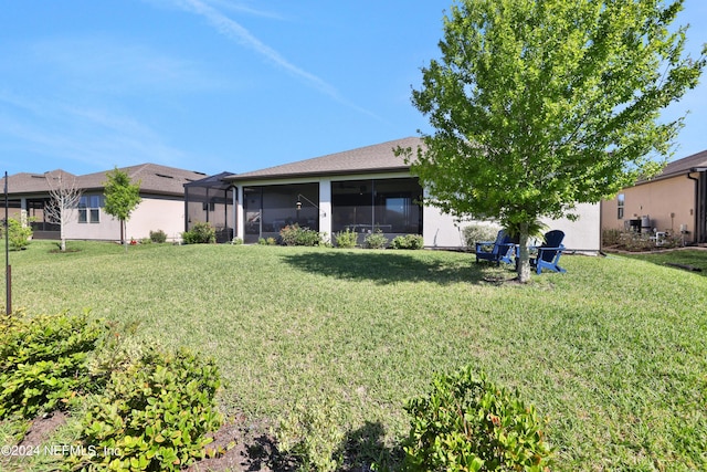 view of yard featuring a sunroom