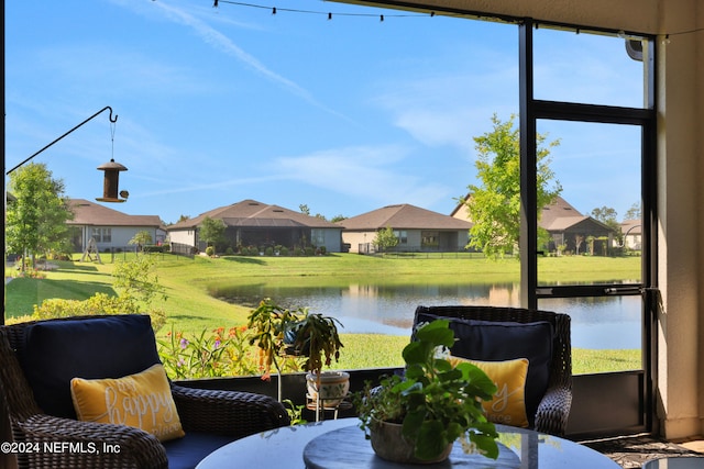 sunroom with a water view