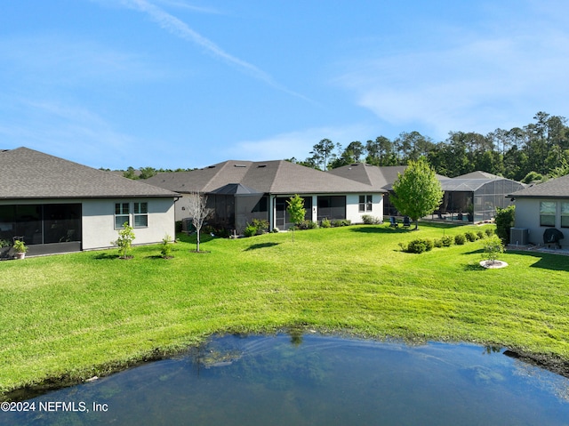 ranch-style house featuring a lanai and a front lawn