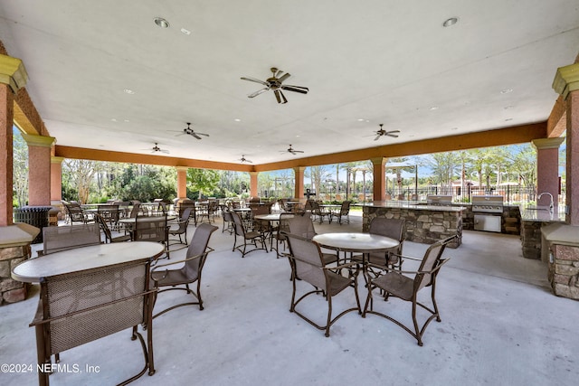 view of patio with ceiling fan and exterior kitchen