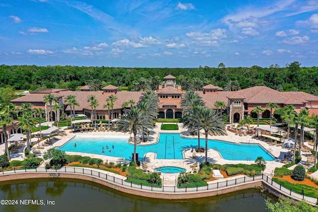 view of pool featuring a patio area and a community hot tub