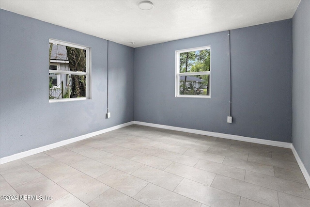 view of tiled spare room