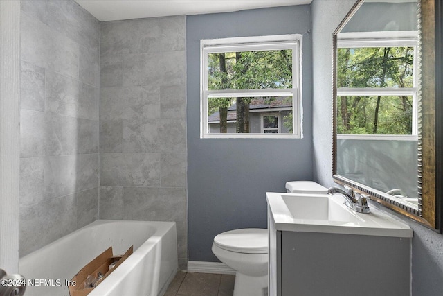 full bathroom with a wealth of natural light, vanity, tile floors, and toilet