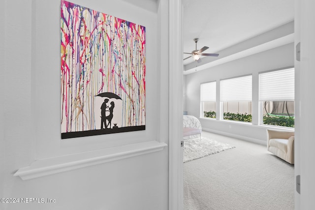 carpeted bedroom with ceiling fan