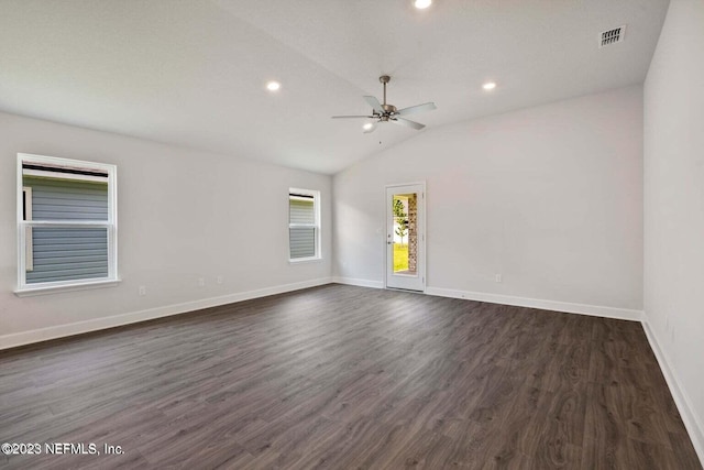 empty room with ceiling fan, recessed lighting, baseboards, vaulted ceiling, and dark wood finished floors