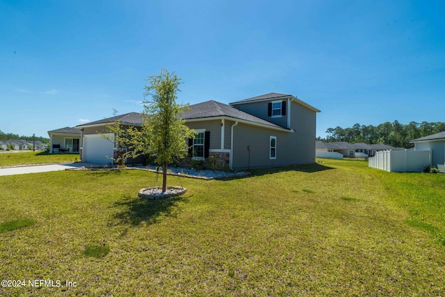 back of property featuring a lawn