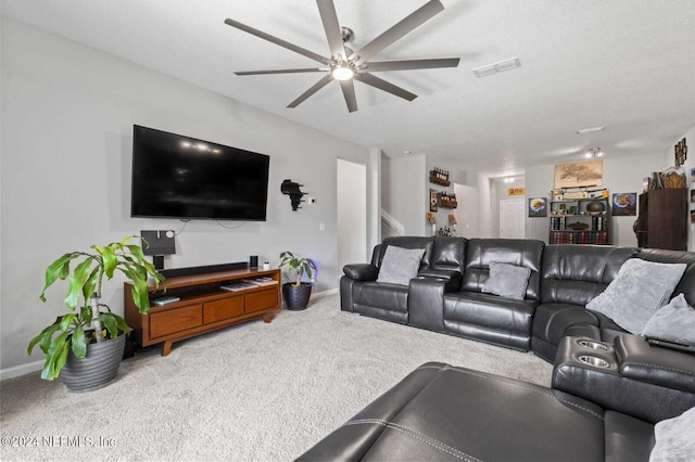 living room featuring carpet flooring and ceiling fan