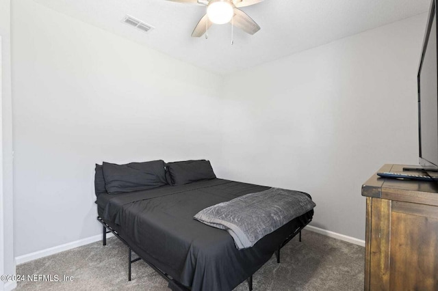 bedroom featuring ceiling fan and carpet