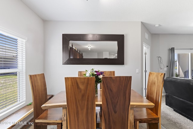 view of carpeted dining space