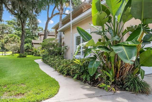 view of property exterior featuring a yard