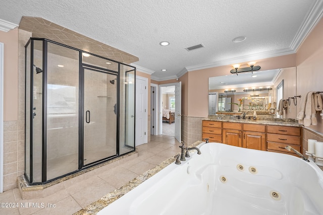 bathroom with vanity, independent shower and bath, a textured ceiling, and ornamental molding