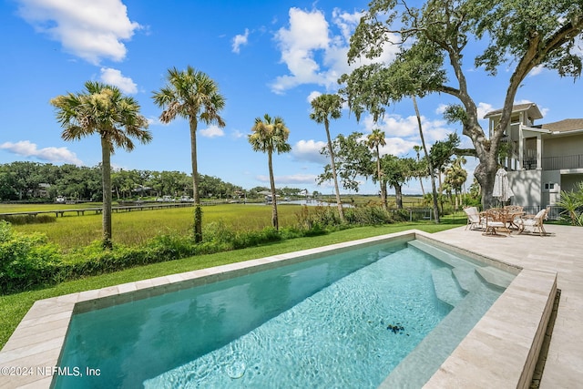 view of swimming pool featuring a patio area