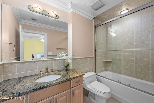 full bathroom with combined bath / shower with glass door, a textured ceiling, crown molding, tile walls, and toilet