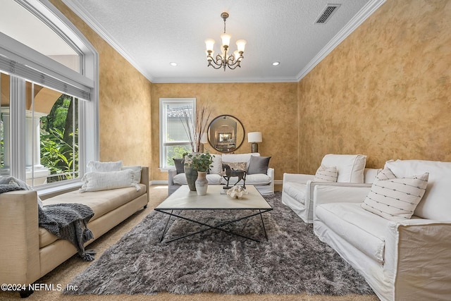 carpeted living room featuring a notable chandelier, a healthy amount of sunlight, ornamental molding, and a textured ceiling