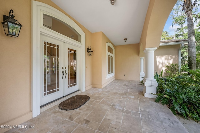 view of exterior entry featuring french doors