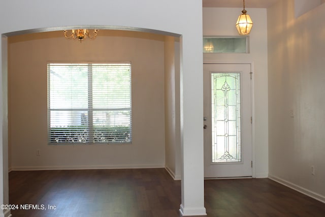 foyer with wood finished floors and baseboards