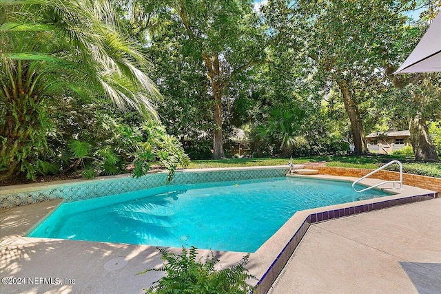 outdoor pool with a patio