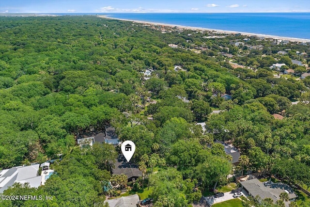 drone / aerial view featuring a water view and a beach view