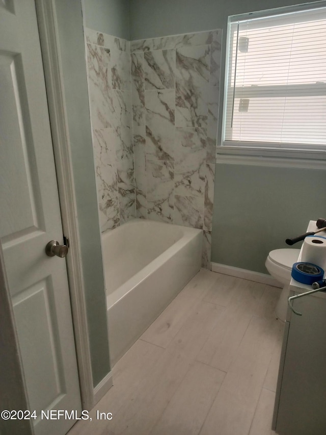 full bathroom featuring vanity, tub / shower combination, toilet, and tile flooring