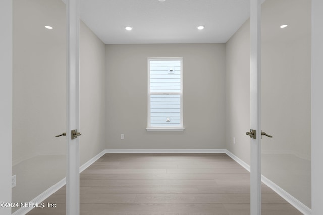 spare room with light hardwood / wood-style floors