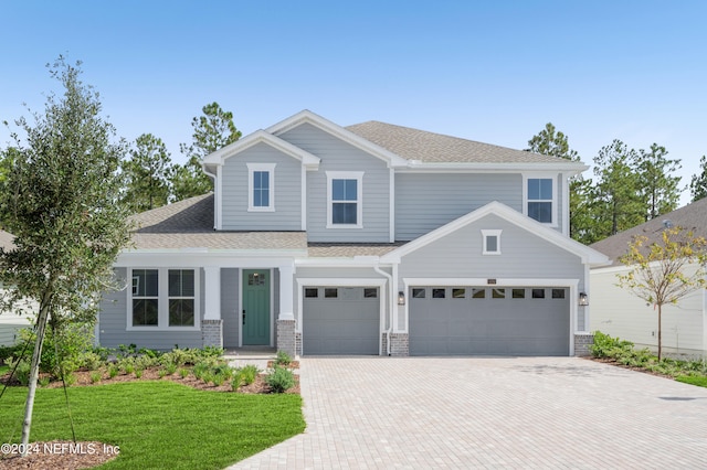 craftsman-style home featuring a front lawn