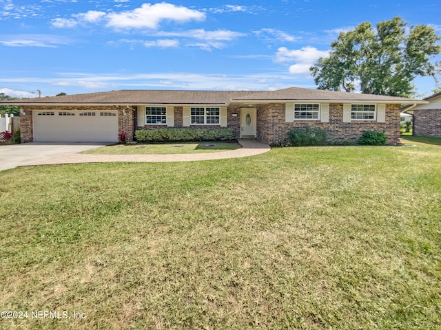 ranch-style home with a front yard and a garage