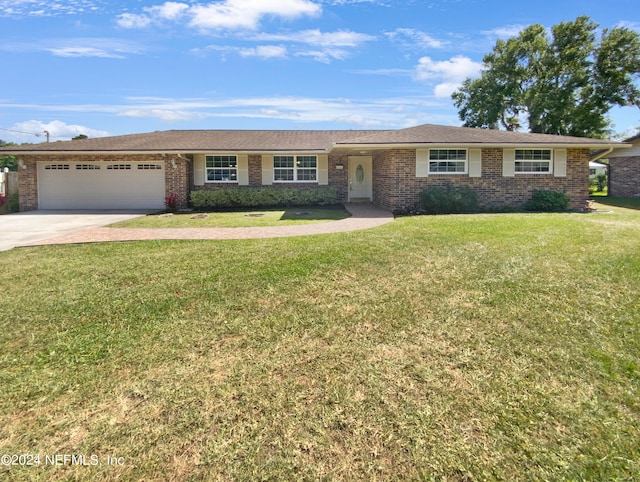 ranch-style house with a front lawn and a garage