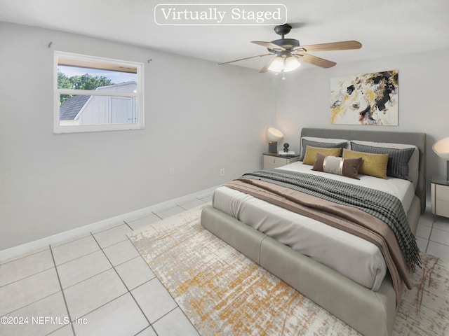 tiled bedroom with ceiling fan