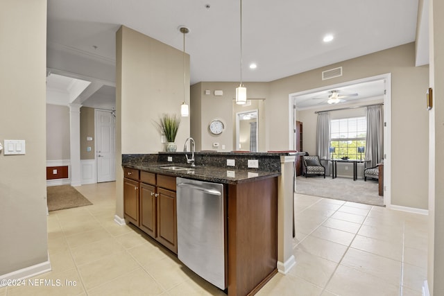 kitchen with sink, decorative columns, decorative light fixtures, stainless steel dishwasher, and dark stone countertops