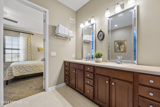 bathroom featuring vanity, ceiling fan, and tile patterned flooring