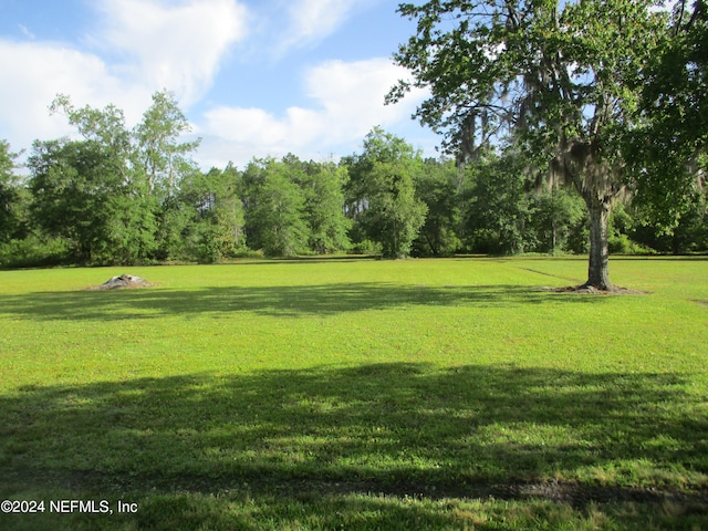 view of home's community featuring a yard