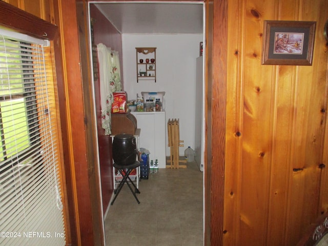 hallway with tile flooring