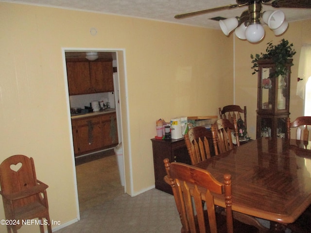 dining room featuring ceiling fan and carpet floors