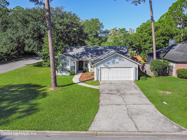 ranch-style house with a front lawn and a garage