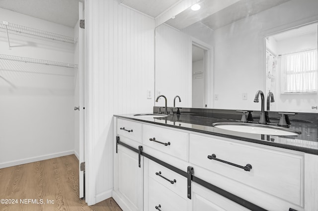 bathroom featuring vanity and hardwood / wood-style flooring