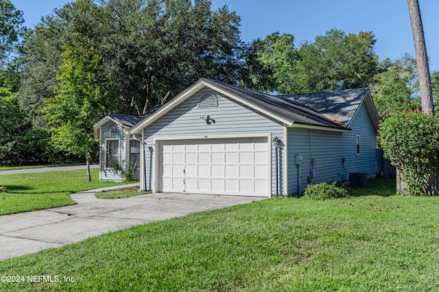 view of home's exterior featuring a yard and a garage