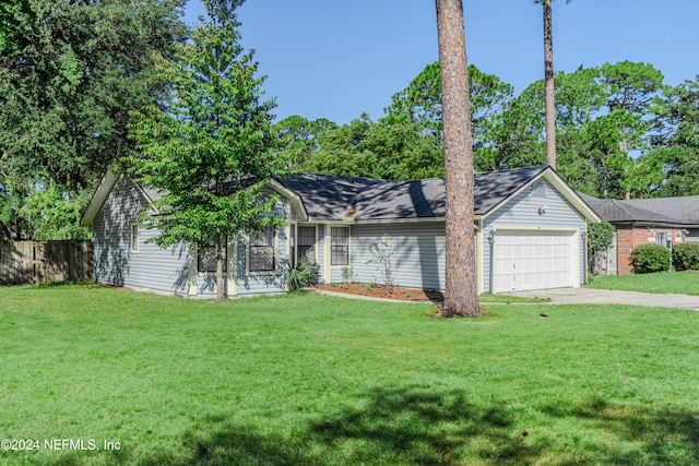 single story home featuring a front lawn and a garage